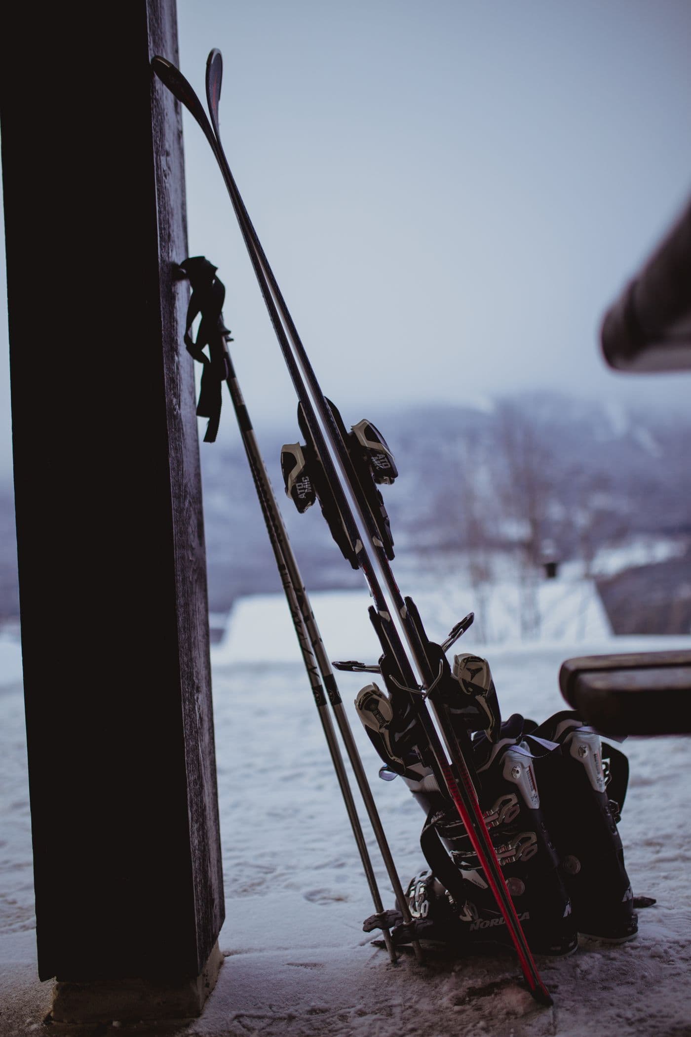 Ski equipment ready for collection outside a mountain lodge